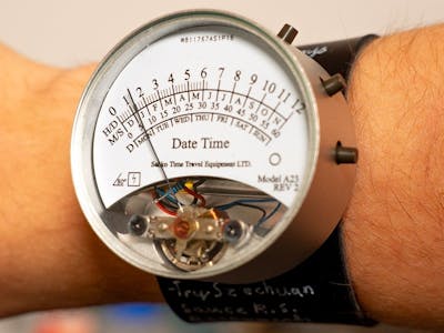 RP2040 Wristwatch Tells Time With a Vintage VU Meter Needle