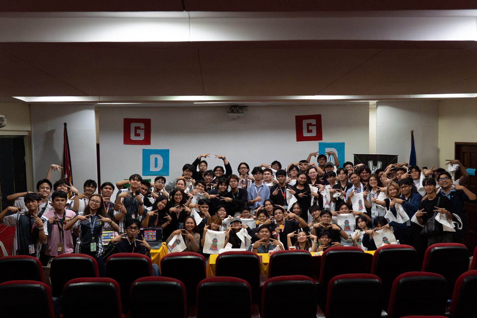 Full SparkFest 2026 crowd at Bulwagang Bonifacio raising GDG letters