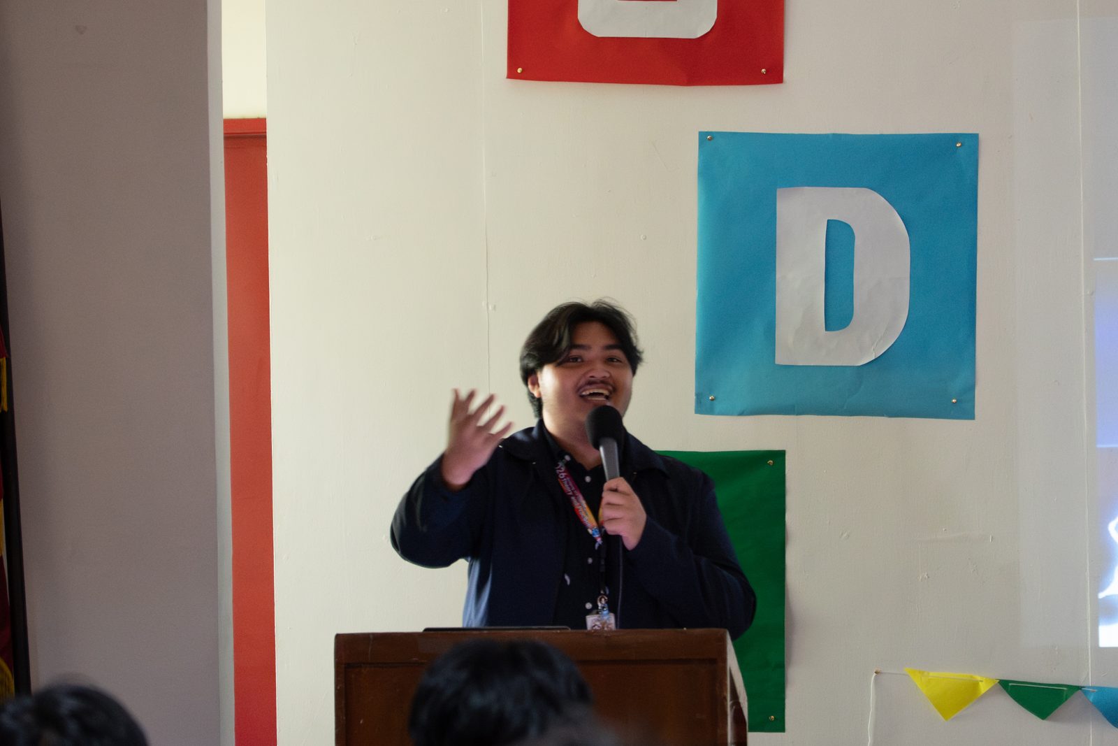 Host opening the SparkFest 2026 program at Bulwagang Bonifacio, PUP