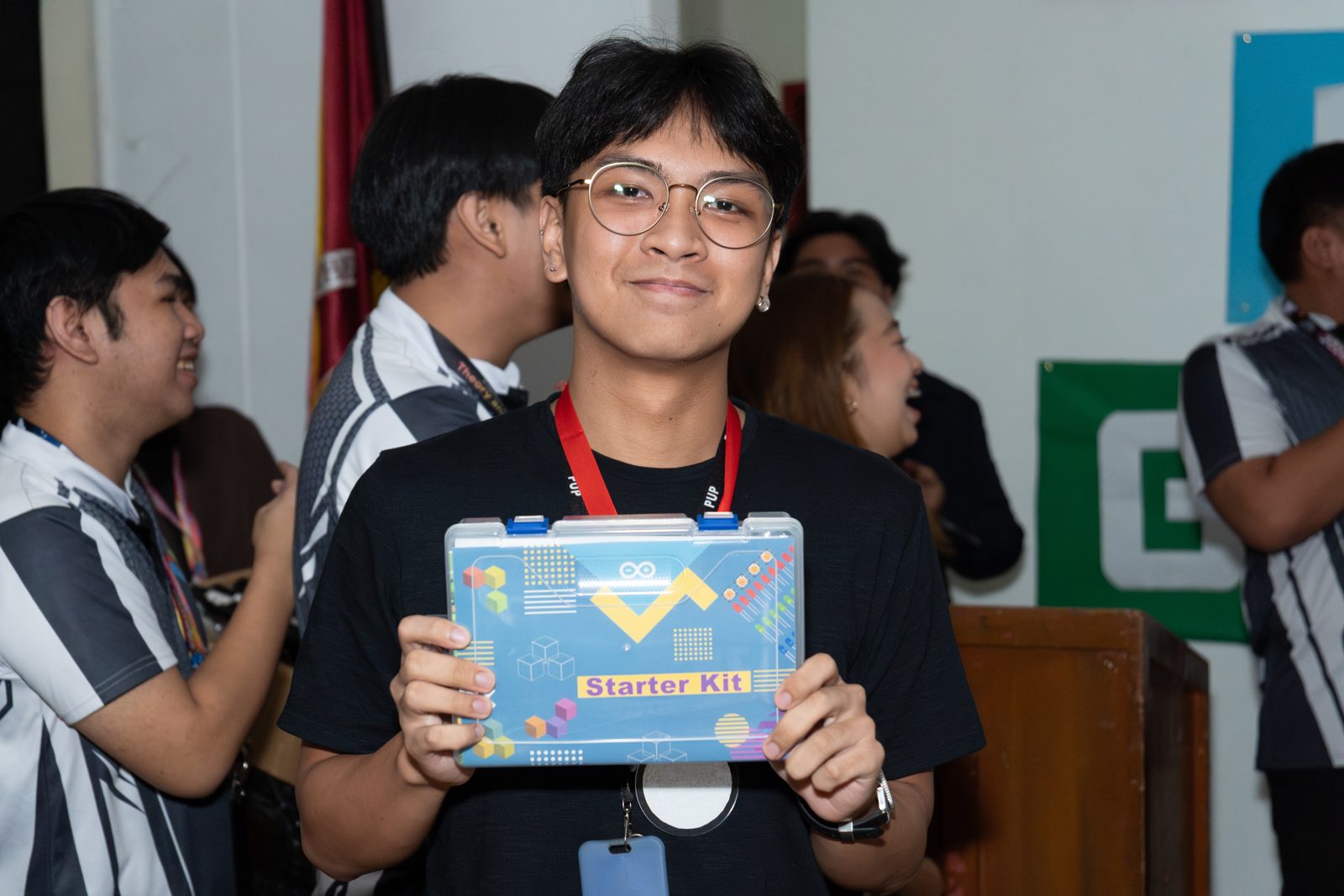Raffle winner holding an Arduino starter kit from Circuitrocks