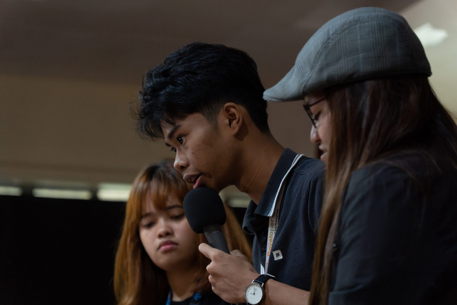 Team huddling over an answer during the judges' Q&A at SparkFest 2026