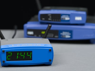 A XIAO ESP32-S3 Clock Hiding Inside a Fake Linksys WRT Router